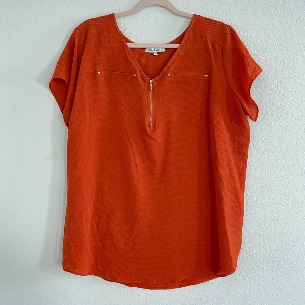 Orange blouse with gold accents